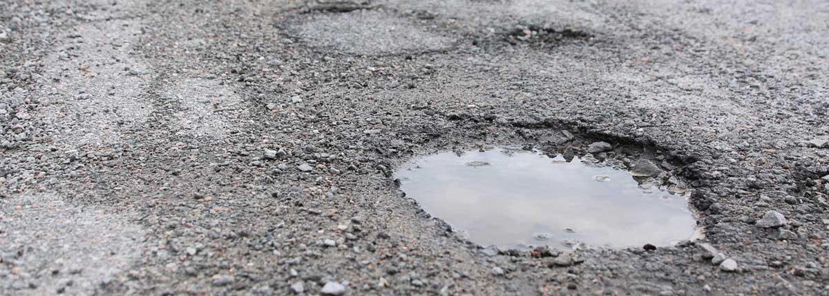 What do you do if you hit a pothole?